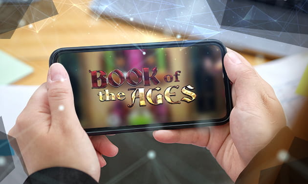 Der Schriftzug von Book of the Ages auf einem Smartphone.