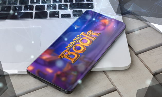 Der Titel des Slots Magic Book auf einem Smartphone.